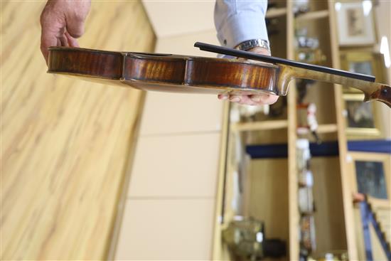 A late 19th century German violin, bears Stradivarius label, cased with bow, back 36cm